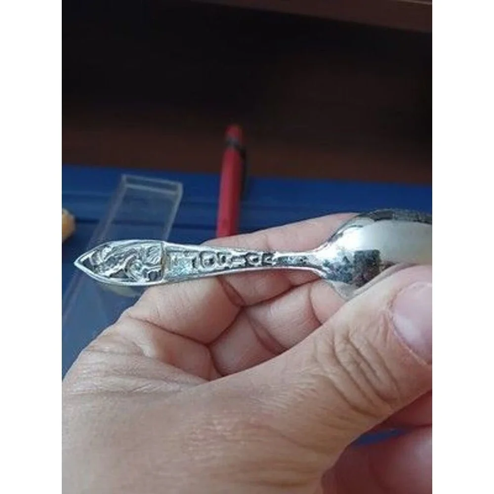This vintage souvenir spoon, Florida theme with a flamingo and palm tree motif.